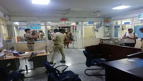 A police team investigating  the ransacked ward of Maharishi Valmiki Hospital in Delhi.