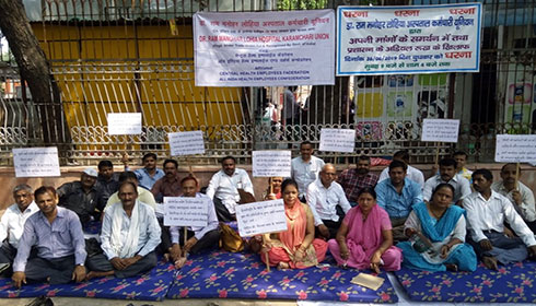 RML Hospital workers sit in dharna in the hospital premises in New Delhi