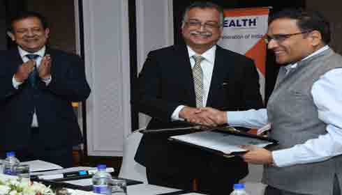 Dr Indu Bhushan with Dr H Sudarshan Ballal at signing of MoU.