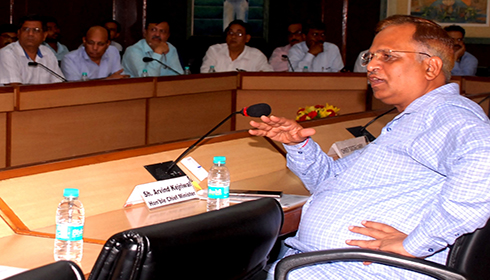 Satyendar Jain holding a meeting of government departments