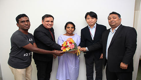 Doctors with patient Shriya after surgery