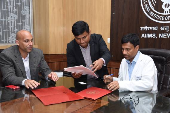Delhi-AIIMS director Prof M Srinivas signing MoU